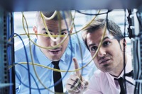 group of young business people it engineer in network server room solving problems and give help and support