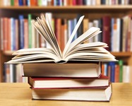 A pile of books with library on the back
